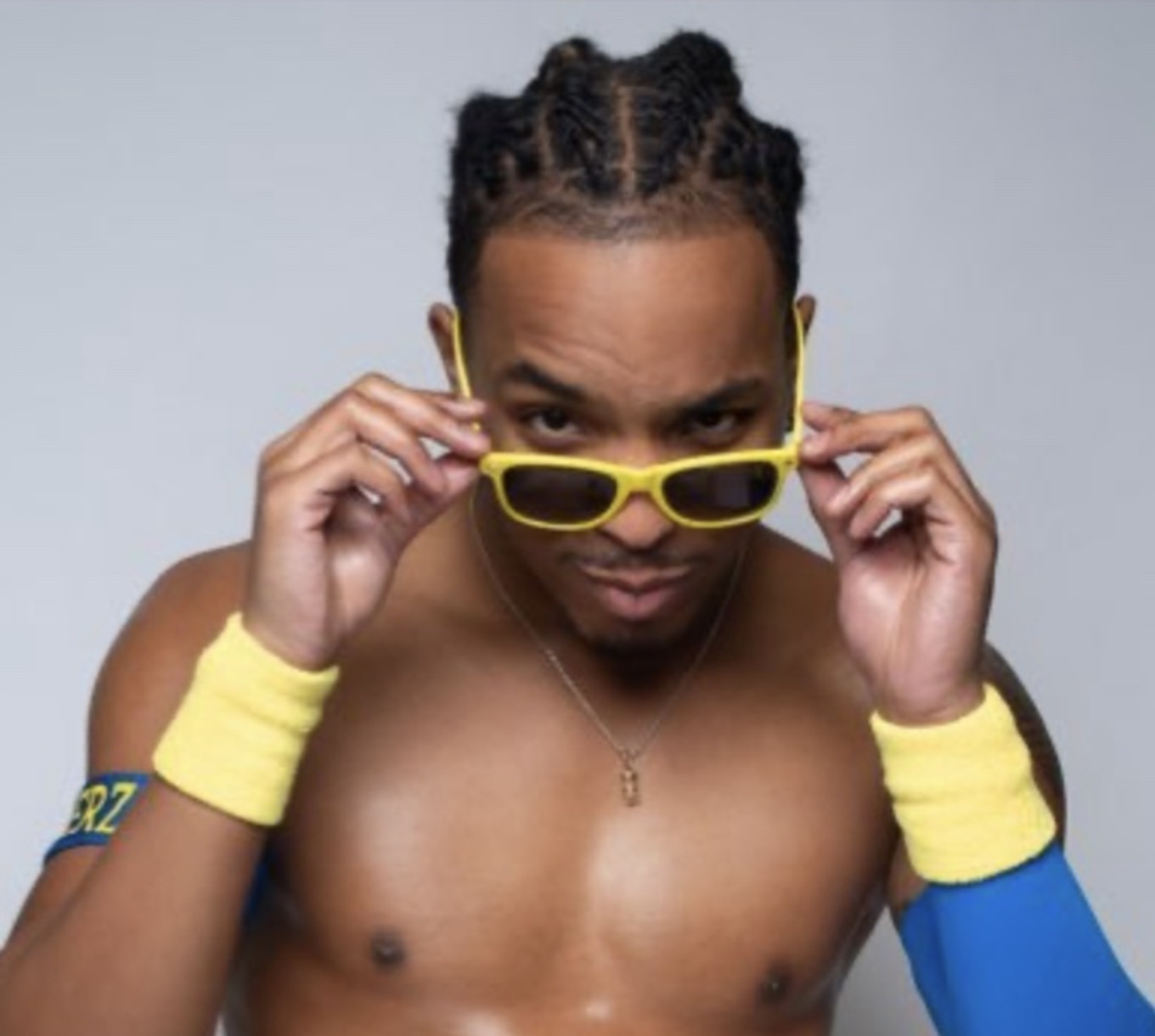 Deon Summerz looking over his yellow sunglasses